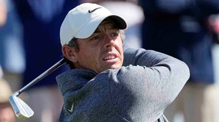 Rory McIlroy watches a shot at the 2023 Players Championship.